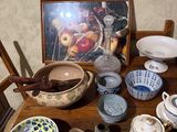 a wooden table topped with bowls and bowls on it