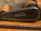 a pair of scissors sitting on top of a piece of leather