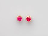 a pair of pink stone stud earrings on a white background