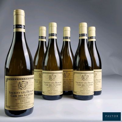six bottles of wine are lined up on a table