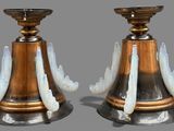 two candles that are sitting on top of each other