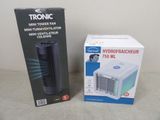 un carton contenant un ventilateur et un carton contenant un purificateur d'air