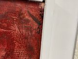 an image of a painting of a red and black painting on a white wall