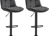 une paire de tabourets de bar gris avec des pieds en métal noir