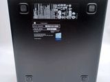 the back of a laptop computer with a hard drive on top of it