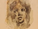 une image représentant une peinture du visage d'une femme sur une feuille de papier