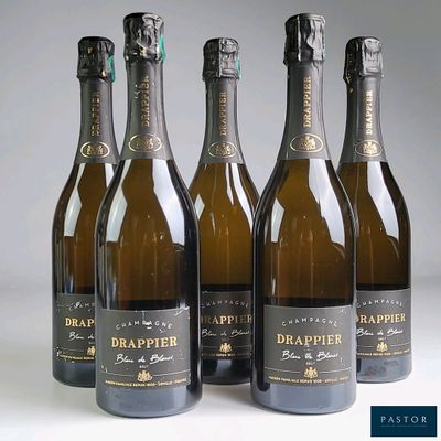 six bottles of champagne are lined up in a row