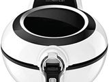 a close up of a white and black air fryer on a white background