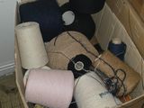 a cardboard box filled with various items on the floor
