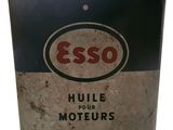 a black and red tin with an esso logo on it