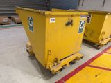 two yellow dumpsters are parked in a warehouse with red lines
