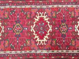 an image of a red rug with a giraffe design on it