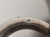 a close up view of a metal object with a hole in it