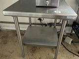 a small table with a toaster on top of it