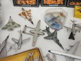 a lot of toy airplanes that are on the table