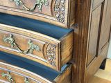 a wooden dresser with three drawers on it on a hard wood floor