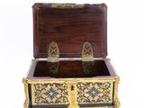a wooden chest with a gold and blue design on it