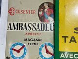 two signs on the wall of a restaurant