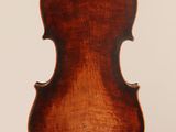 an old violin with a wooden back and a long neck