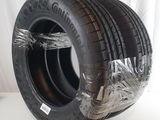a close up of a tire wrapped in plastic on a white surface