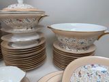 many plates and bowls stacked on top of each other