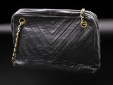 a chanel black quilted leather shoulder bag with gold hardware