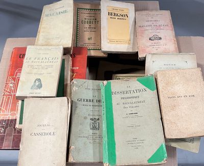 a lot of books that are stacked on top of each other