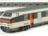 a toy train that is sitting on a white surface