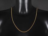 un collier à chaîne en or sur un mannequin mannequin mannequin mannequin mannequin mannequin mannequin mannequin mannequin mannequin