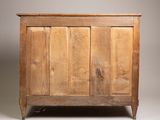 an old wooden chest with three doors and two drawers
