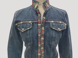 a close up of a mannequin mannequin wearing a jean jacket
