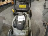 an image of a lawn mower in a warehouse