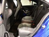 a blue car that is sitting in the back of the car