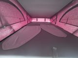 a pink tent that has two beds in it