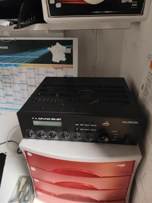 a stack of electronics sitting on top of a desk