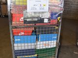 a metal cart with many boxes on it in a warehouse
