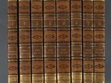 a set of twelve books in brown leather with gold covers