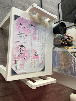 a picture of a desk with a magazine rack and a magazine holder