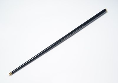 a close up of a pencil on a white surface with a white background