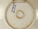 a close up of a plate with a ring on it