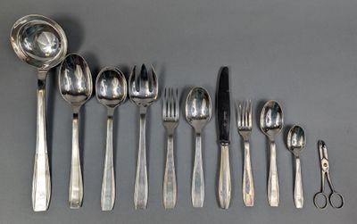 several spoons, forks, and spoons are lined up on a table