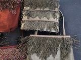 two purses sitting next to each other on a table