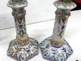 two vases that are sitting on a table