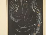 painting of a blackboard with a drawing of a bird and fish on it
