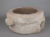 a stone bowl that is sitting on a table