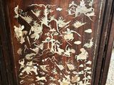 a wooden cabinet with a floral design on it