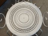 a white table with a circular design on top of it