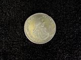 a coin with a picture of a woman on it