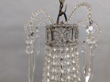 a crystal chandelier hanging from the ceiling