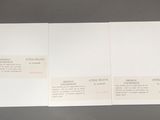 two pages of white paper with black writing on them on a table